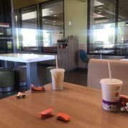 Overflowed trash can and if you look close there are no customers.