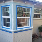 a window with a blue trim