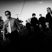 a black and white photo of a group of men
