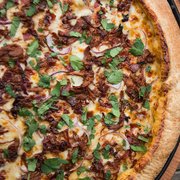 Kickin' Carnitas: Southern chipotle sauce, slow marinated carnitas, crispy bacon, red onions and fresh cilantro