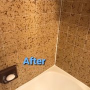 This new silicone caulking brings life back to the old shower surround.