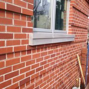 a brick wall with a window