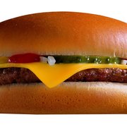 a hamburger with cheese and pickles