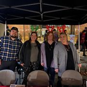 Austin hosting the Century 21 booth at Chico's Christmas Preview.