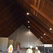a group of construction workers walking through a building
