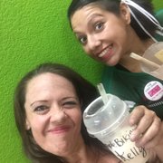 a woman and a woman holding a drink