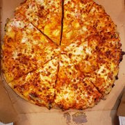 a pizza in a cardboard box
