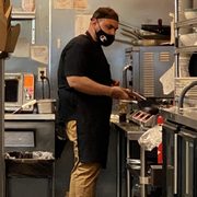 a man in a restaurant kitchen