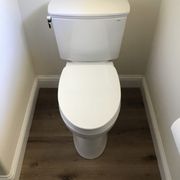 Replaced an old toilet with a water saving dual flush model.