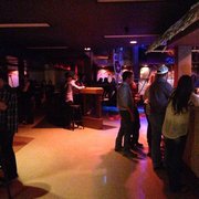 a group of people at a bar
