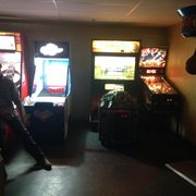 a man playing a game of pinball