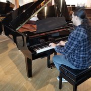 Our instructor Alex is having fun on the Yamaha C3X... Playing this piano will draw you in... there's a certain tantalizing allure about it.