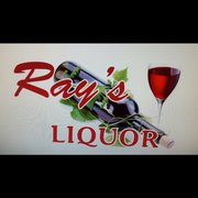 a glass of red wine and a bottle of liquor