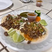 Carne Asada tacos and a chicken burrito supreme