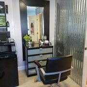 One of the two stations in this cozy salon.