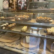 a display case filled with pastries