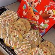 a tray of cookies and a box of fruit pebbles