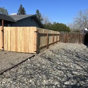 a fence and gravel