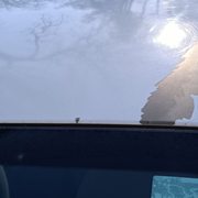 Driver side of roof paint flake indication of repaint after wreck