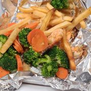 Cold fries, cold veggies,  and overcooked shrimp.