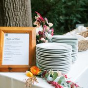 a table with plates and a menu