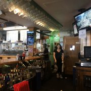 a woman standing at the bar