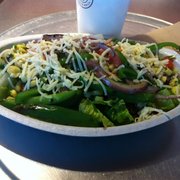 Steak salad complete w/black beans, corn & red salsa, fajita veggies, brown rice, & shredded cheese - $6.70