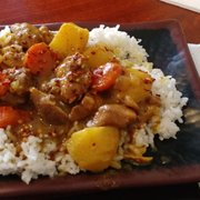 Curry Chicken, medium heat. (Options are mild, med, spicy) Comes with potatoes, carrots, rice as shown. Lots of sauce.