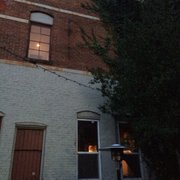 a brick building with a clock on it