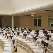 rows of white folding chairs