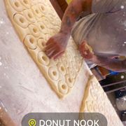 a man rolling out dough
