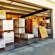 stacks of boxes and pallets in a warehouse