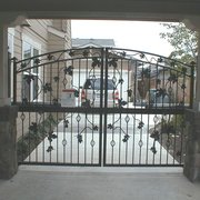 Arched double gate w/grapevine,grape clusters and bird's nest baskets