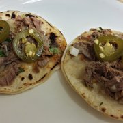 Barbacoa tacos with spicy salsa (jalapenos added by me.)