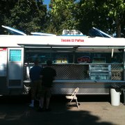 two people ordering food from a food truck