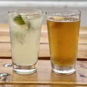 two glasses of beer on a wooden table