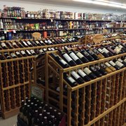 rows of bottles of wine in a store