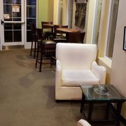seating area with flat screen tvs