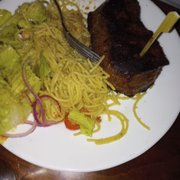 Steak (main dish) with pasta and salad (among the side dishes).