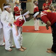 Bow down young one ,  don't worry Mrs. Miranda we'll teach her the proper Bow technique .