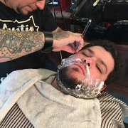 It's important to relax when you have a straight edge blade against you, and Tony kept assuring Eric that he was doing great!
