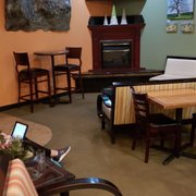 lounge area with tv, table and chairs