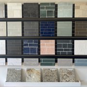 more backsplash tile and a selection of granite countertops