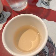 a bowl of soup and a glass of water