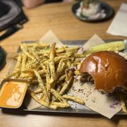 Pittsburgh fusion with fries. It's pastrami with smoked Gouda, provolone, kimchi mayo slaw, fries on a brioche bun. Very good.