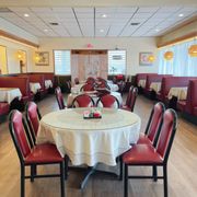 a dining room with red booths and white tablecloths