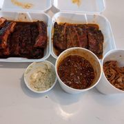 Full rack of ribs St. Louis style and South Carolina mustard. Potato salad, baked beans and pulled pork.