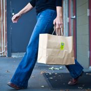 a woman carrying a shopping bag