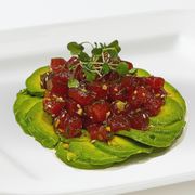 an avocado dish on a white plate