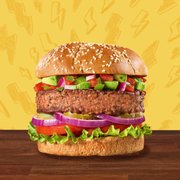 a hamburger with lettuce, tomatoes, and onions